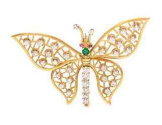 An 18 Karat Yellow Gold, Diamond, Emerald and Ruby Articulated Butterfly Brooch, 6.20 dwts.