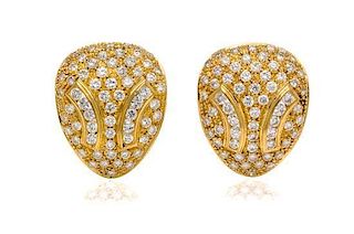 * A Pair of 18 Karat Yellow Gold and Diamond Earclips, 8.90 dwts.