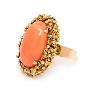 A 14 Karat Yellow Gold and Coral Ring, 9.40 dwts.