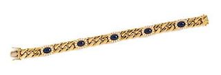 An 18 Karat Yellow Gold, Sapphire and Diamond Curb Link Bracelet, 40.70 dwts.