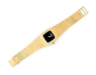 * An 18 Karat Yellow Gold Wristwatch, Baume & Mercier, 40.90 dwts.