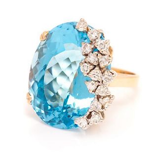 A 14 Karat Bicolor Gold, Blue Topaz and Diamond Ring, 12.60 dwts.