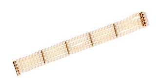 * An 18 Karat Yellow Gold and Cultured Pearl Multistrand Bracelet, 14.10 dwts.