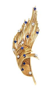 An 18 Karat Yellow Gold, Diamond and Sapphire Feather Motif Brooch, 10.10 dwts.