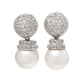 A Pair 18 Karat White Gold, Diamond and Cultured Pearl Drop Earclips, 11.80 dwts.