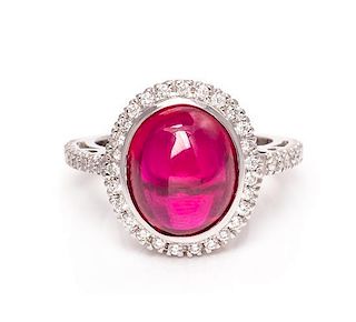 A 14 Karat White Gold, Synthetic Ruby and Diamond Ring, 4.60 dwts.