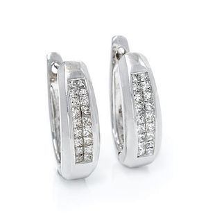 A Pair of 14 Karat White Gold and Diamond Earrings, 4.50 dwts.