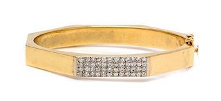 * A 14 Karat Yellow Gold and Diamond Bangle Bracelet, 10.40 dwts.