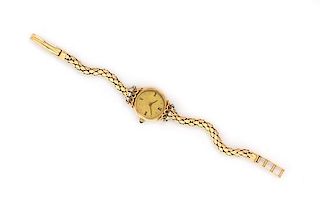 A 18 Karat Yellow Gold and Diamond Wristwatch, French, 14.00 dwts.