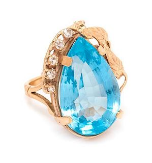 A Yellow Gold, Blue Topaz and Diamond Ring, 9.00 dwts.