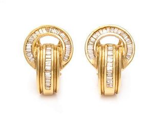 A Pair of 14 Karat Yellow Gold and Diamond Earclips, 5.20 dwts.