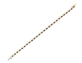 * A Yellow Gold, Diamond and Sapphire Line Bracelet, 6.50 dwts.