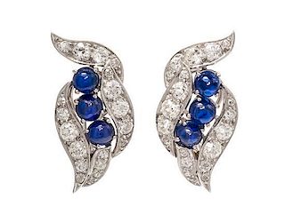 A Pair of Art Deco Platinum, Sapphire and Diamond Earclips, 9.40 dwts.