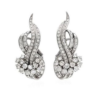 * A Pair of Platinum and Diamond Earclips, 15.40 dwts.