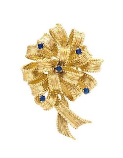 * An 18 Karat Yellow Gold and Sapphire Bow Brooch, Tiffany & Co., 13.10 dwts.