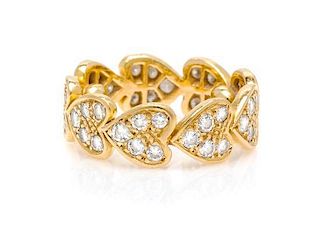 An 18 Karat Yellow Gold and Diamond "Hearts of Diamonds" Eternity Ring, Cartier, 3.20 dwts.