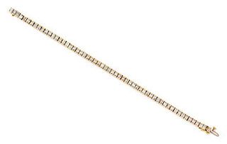 A Yellow Gold and Diamond Line Bracelet, 14.20 dwts.