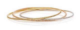 An 18 Karat Tricolor Gold and Diamond Triple Rolling Bangle Bracelet, 12.30 dwts.