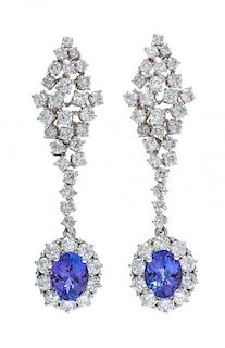 A Pair of White Gold, Tanzanite and Diamond Pendant Earrings, 7.40 dwts.