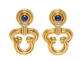 A Pair of 18 Karat Yellow Gold, Diamonds and Sapphire Earclips, 32.70 dwts.