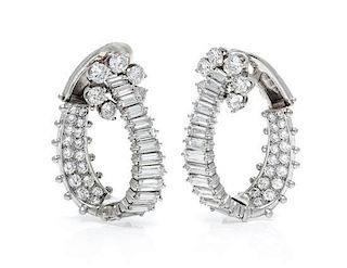 A Fine Pair of Platinum and Diamond Hoop Earclips, 13.70 dwts.