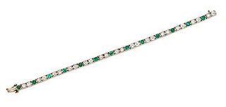 * A Yellow Gold, Diamond and Emerald Line Bracelet, 14.30 dwts.