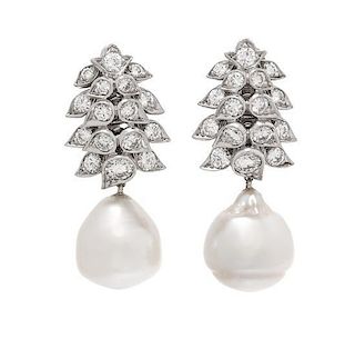 A Pair of Platinum, Cultured Pearl and Diamond Earclips, 10.90 dwts.