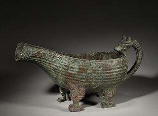 A bronze ladle with a dragon shaped handle,Han Dynasty,China