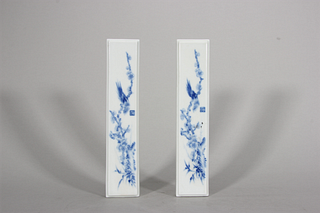 A pair of blue and white flower and bird porcelain paperweights,the Republic of China