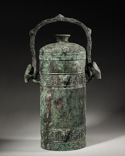 A phoenix bird patterned loop-handled bronze pot,Han Dynasty,China