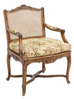 FRENCH LOUIS XV STYLE CARVED WALNUT & CANED FAUTEUIL