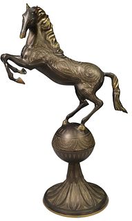 LARGE ENGRAVED METAL SCULPTURE REARING HORSE ABOVE SPHERE