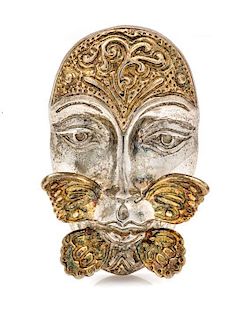 * A Sterling Silver and Yellow Gold Face and Butterfly Motif Pendant/Brooch, Sergio Bustamante, 18.70 dwts.