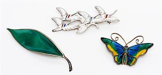 A Collection of Gilt Silver and Polychrome Enamel Brooches, 19.40 dwts.