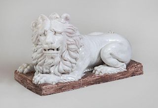 CONTINENTAL WHITE GLAZED POTTERY RECUMBENT LION