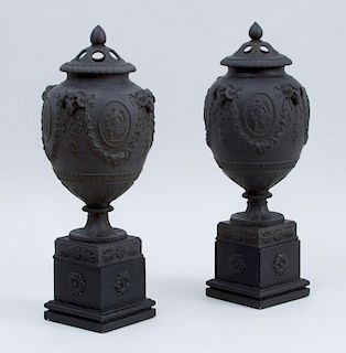 PAIR OF WEDGWOOD AND BENTLEY POTTERY BLACK BASALT URNS AND COVERS