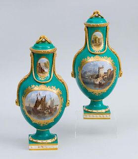PAIR OF ENGLISH VICTORIAN PORCELAIN PICTORIAL EMERALD GREEN GROUND URNS AND COVERS