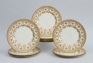 SET OF TWELVE ROYAL DOULTON GOLD-HIGHLIGHTED CHINA TWELVE-SIDED SERVICE PLATES, RETAILED BY TIFFANY & CO.