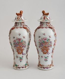 PAIR OF CHINESE EXPORT FAMILLE ROSE PORCELAIN BALUSTER-FORM JARS AND COVERS, IN THE MANDARIN PALETTE