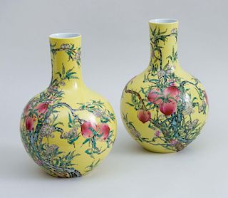PAIR OF CHINESE YELLOW-GROUND FAMILLE ROSE PORCELAIN BOTTLE VASES