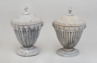 PAIR OF NEOCLASSICAL STYLE LEAD COVERED URNS AND COVERS