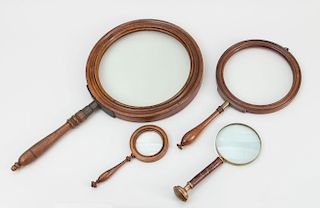 FOUR MAGNIFYING GLASSES