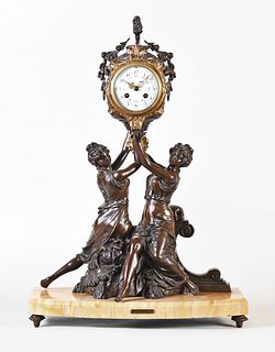 French figural mantel clock on yellow marble base with two female figures