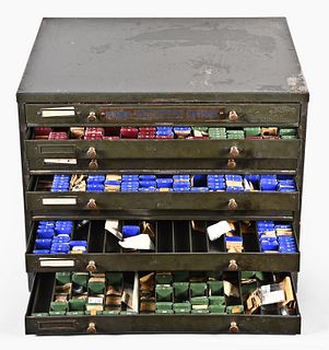 A large eight drawer material cabinet with parts for Longines Wittnauer and LeCoultre