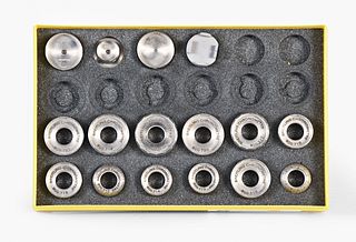 A set of twelve case opening dies and movement holders for Breitling watches