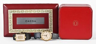 A lot of two Omega quartz wrist watches with boxes, one in 14 karat gold