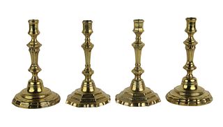 Two Pairs of Louis XVI Brass Candlesticks