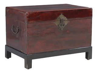 DIMNUTIVE CHINESE LACQUERED PIGSKIN TRUNK ON STAND