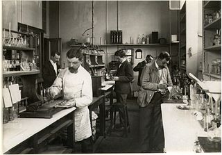SCIENTISTS. Scientists at Work in a Laboratory, C1920
