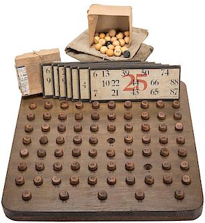 A Keno Ball Board With 73 (of 75) Wood Keno Balls, an H.E. Mason Box of 25 Keno Balls, and 10 H.C. Evans Keno Cards.